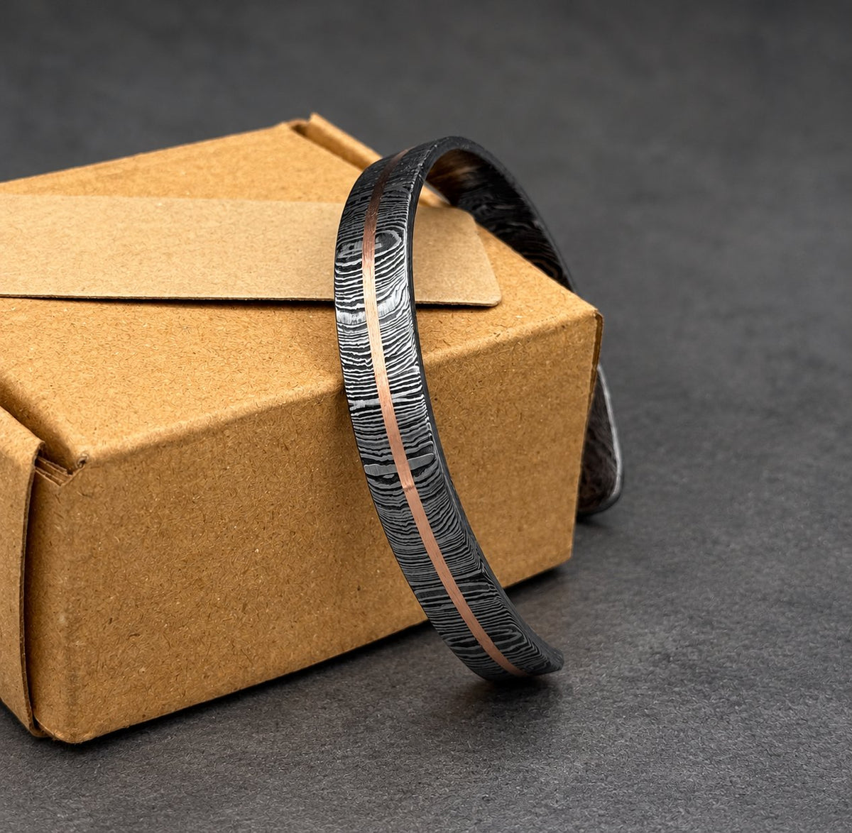 Close-up of copper inlay on Damascus steel Viking bangle