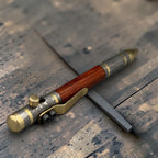 Close-up of solid copper clip on Damascus steel pen barrel