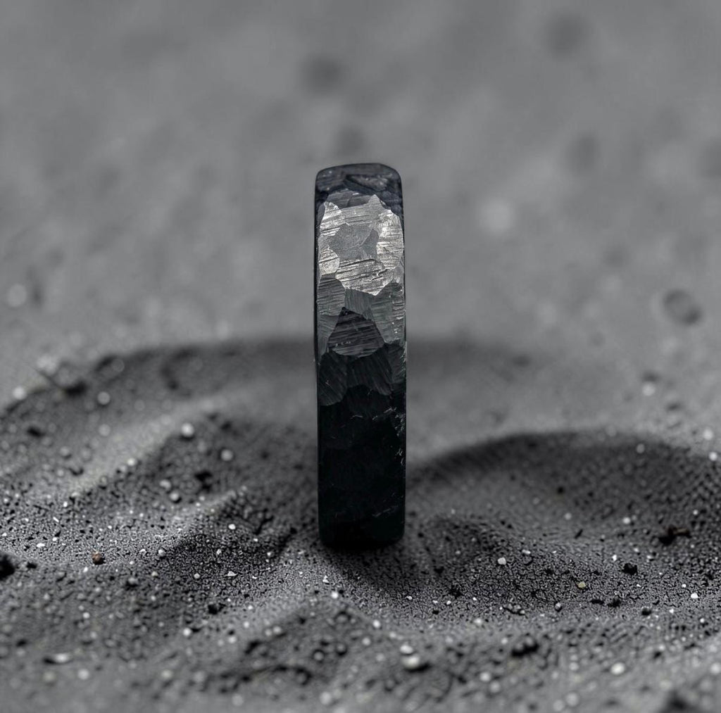 Zirconium wedding band detail shot highlighting depth of the hammered pattern