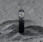 Zirconium wedding band detail shot highlighting depth of the hammered pattern