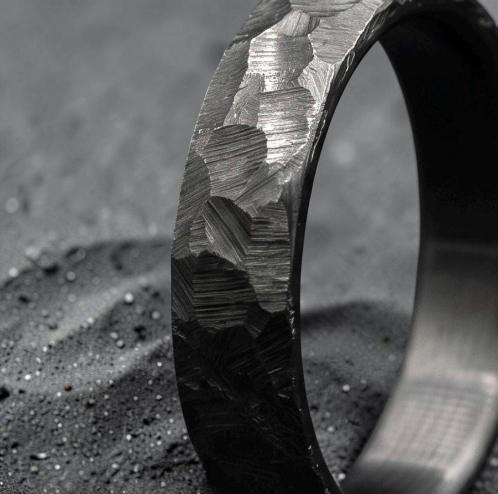 Black zirconium ring showing hammered texture and matte ceramic finish, side view