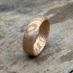 Personalized acid etched mokume gane wedding band with engraved interior