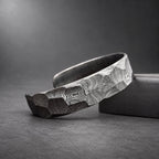 Damascus steel bracelet close-up showing hammered facet pattern