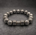 Damascus steel beaded bracelet showing adjustable cord and bead count