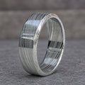 Close-up of Damascus stainless steel band showing etched layer pattern