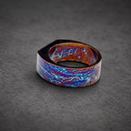 A wide, flat ring with a unique, swirling pattern in shades of blue, purple, and brown.