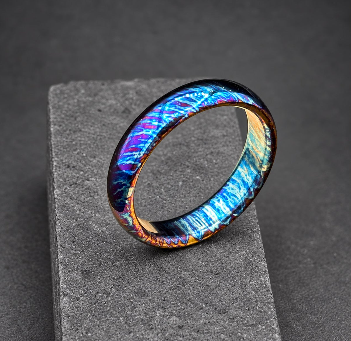 A blue, purple and silver ring with a brushed metal finish.