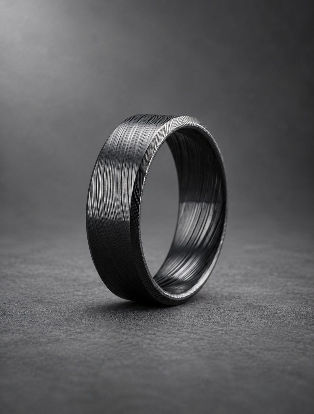 Black beveled Damasteel band, side view