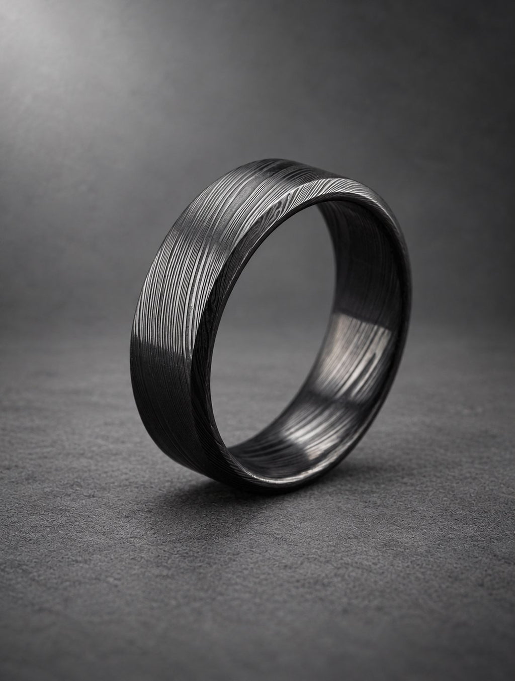 Black beveled Damasteel band, three-quarter view